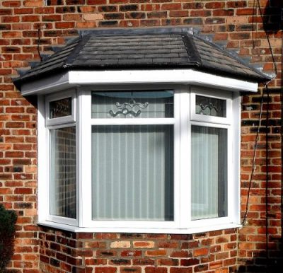 Bay Glass window with white upvc finish and decorative glass