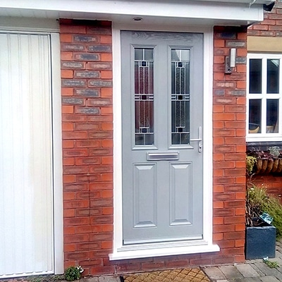 light grey doors with aspen glass and silver finish